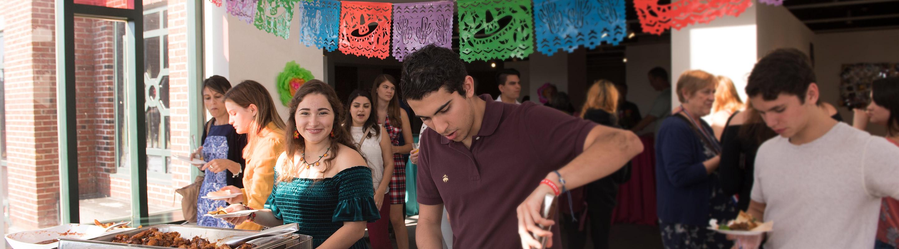 Students hosting international buffet